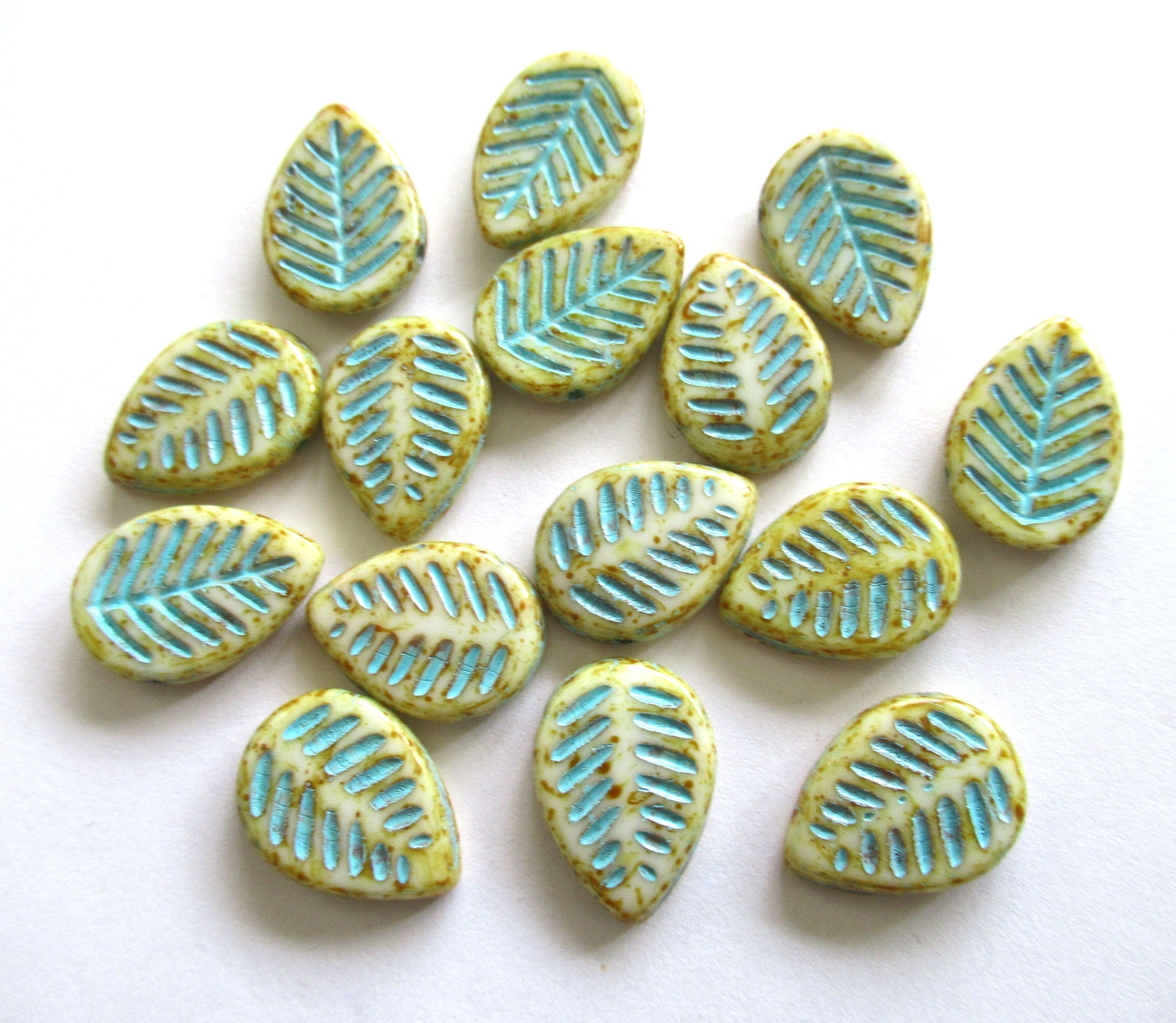 Ten large Czech glass leaf beads - side drilled off white beads with a turquoise wash and picasso finish - 12 x 16mm carved beads C00021