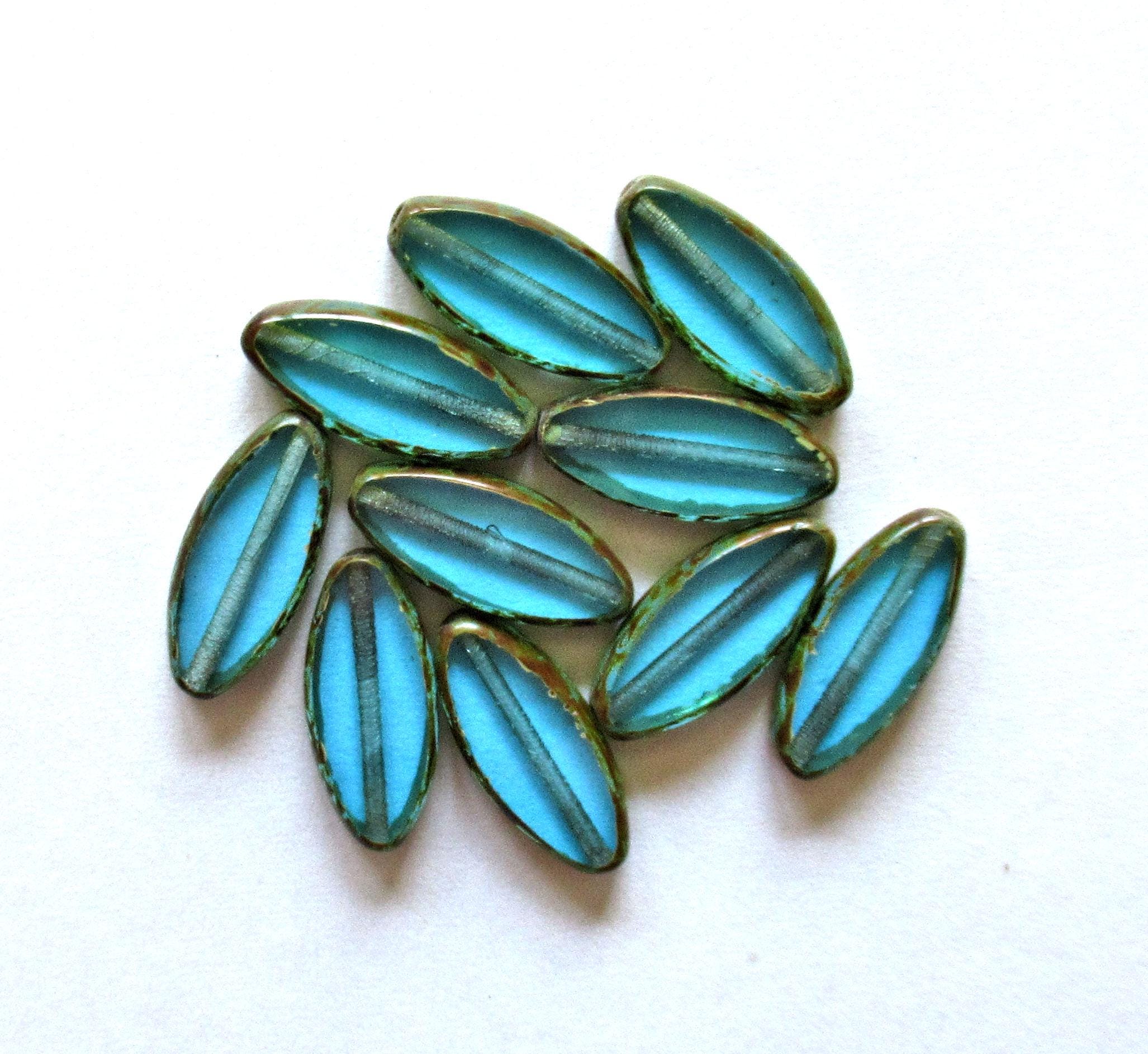 Ten Czech glass spindle beads - transparent aqua blue - 18 x 7mm - table cut beads - C00052