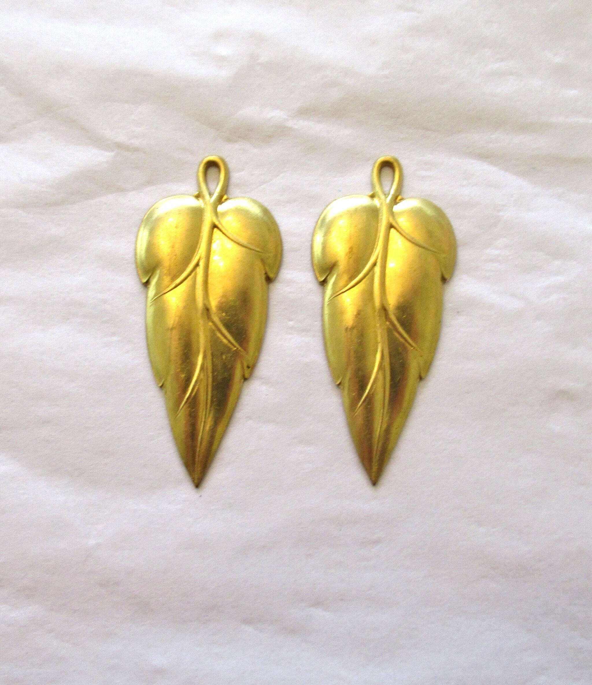 2 stylized raw brass leaf stampings - leaves - pendants - charms - earrings with ring 44mm in by 19mm - made in the USA 0079