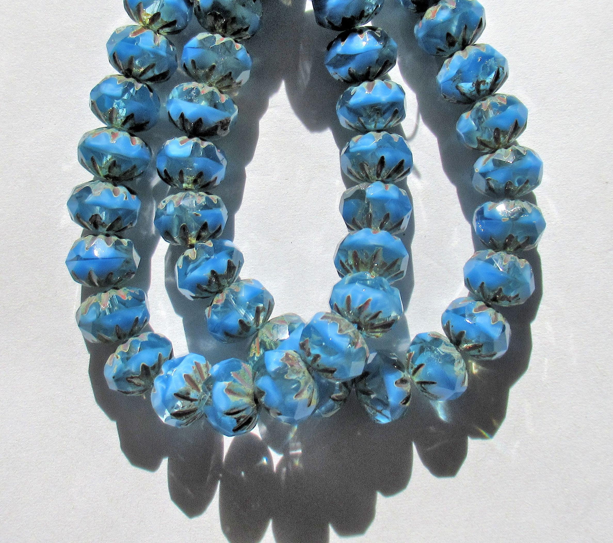 Ten Czech glass faceted carved cruller beads - 10 x 7mm - sky blue silk and crystal clear mix w/ picasso accents - 000451