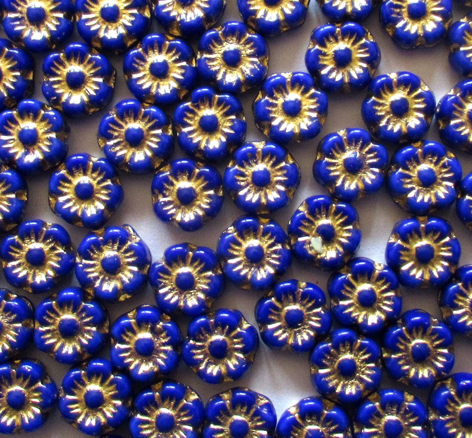 25 small Czech glass flower beads - 6mm - opaque royal blue beads with a gold wash - C0088