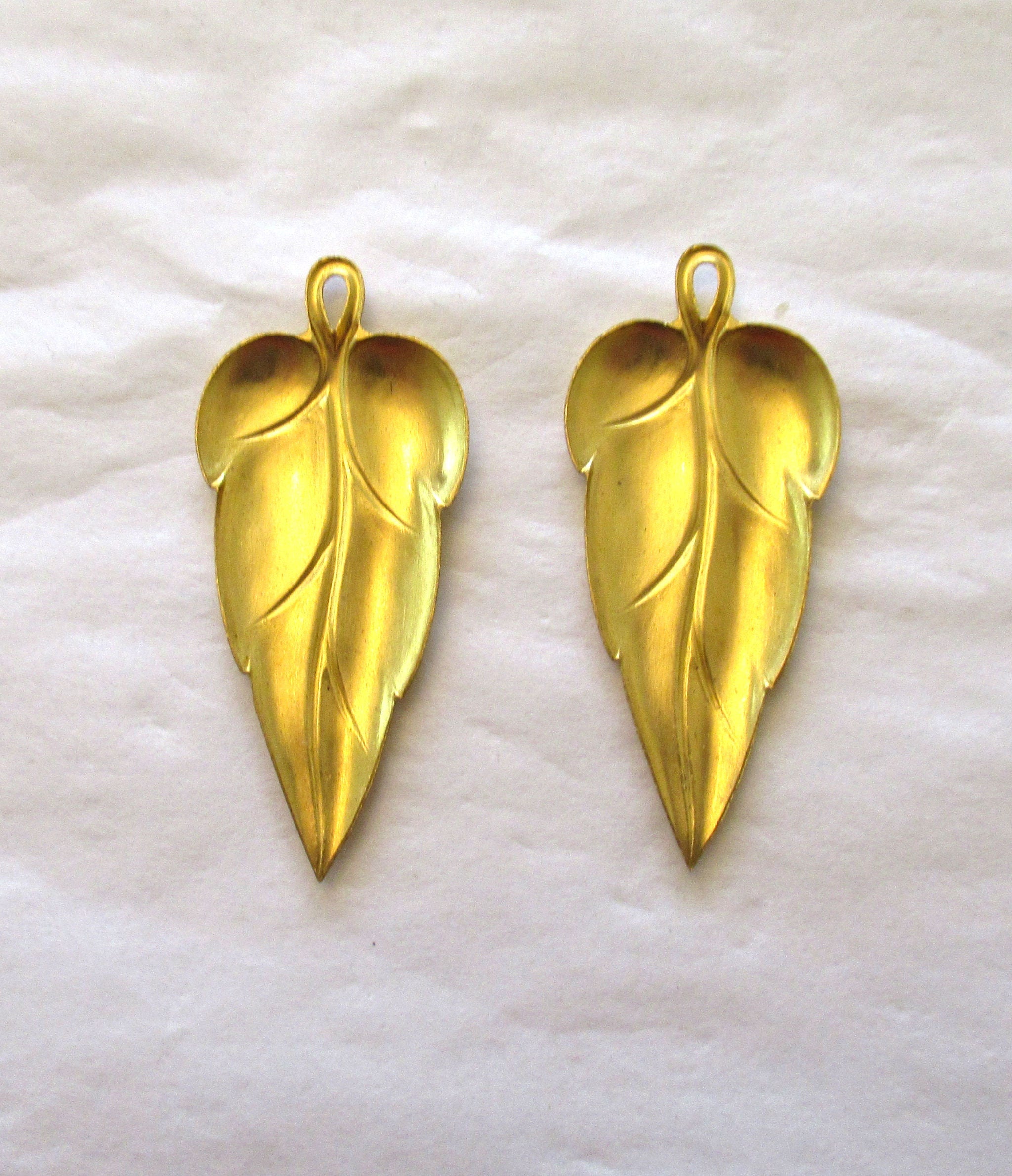 2 stylized raw brass leaf stampings - leaves - pendants - charms - earrings with ring 44mm in by 19mm - made in the USA 0079