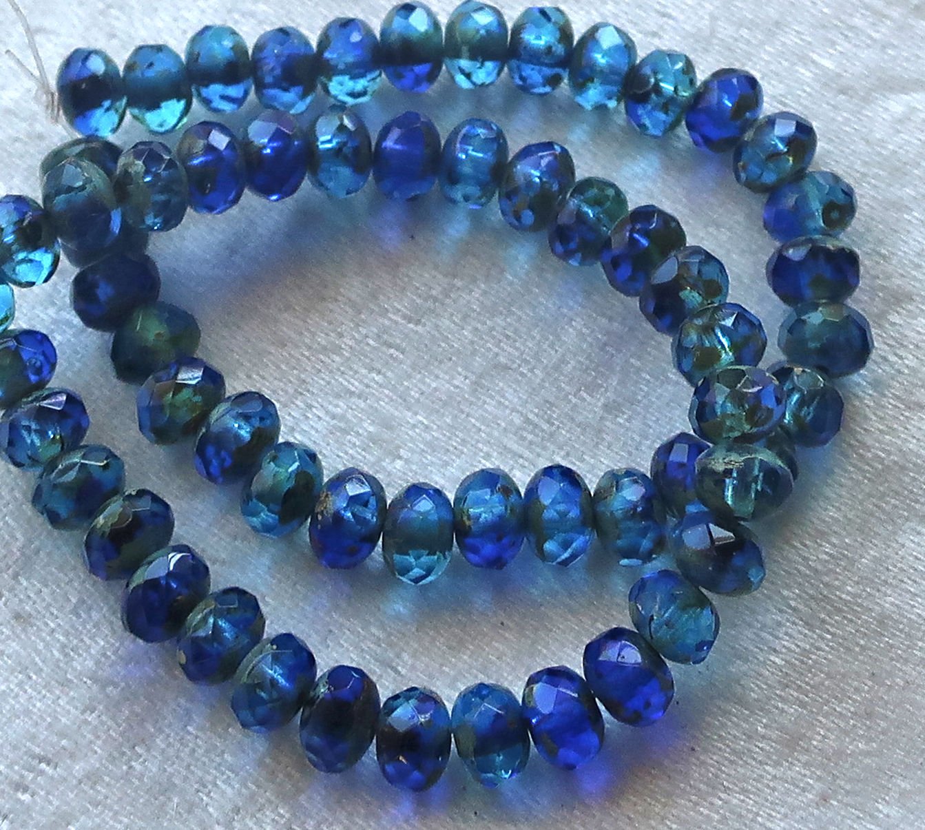 30 small puffy rondelle beads, transparent sapphire & aqua blue picasso mix, 3 x 5mm faceted Czech glass rondelles C53101