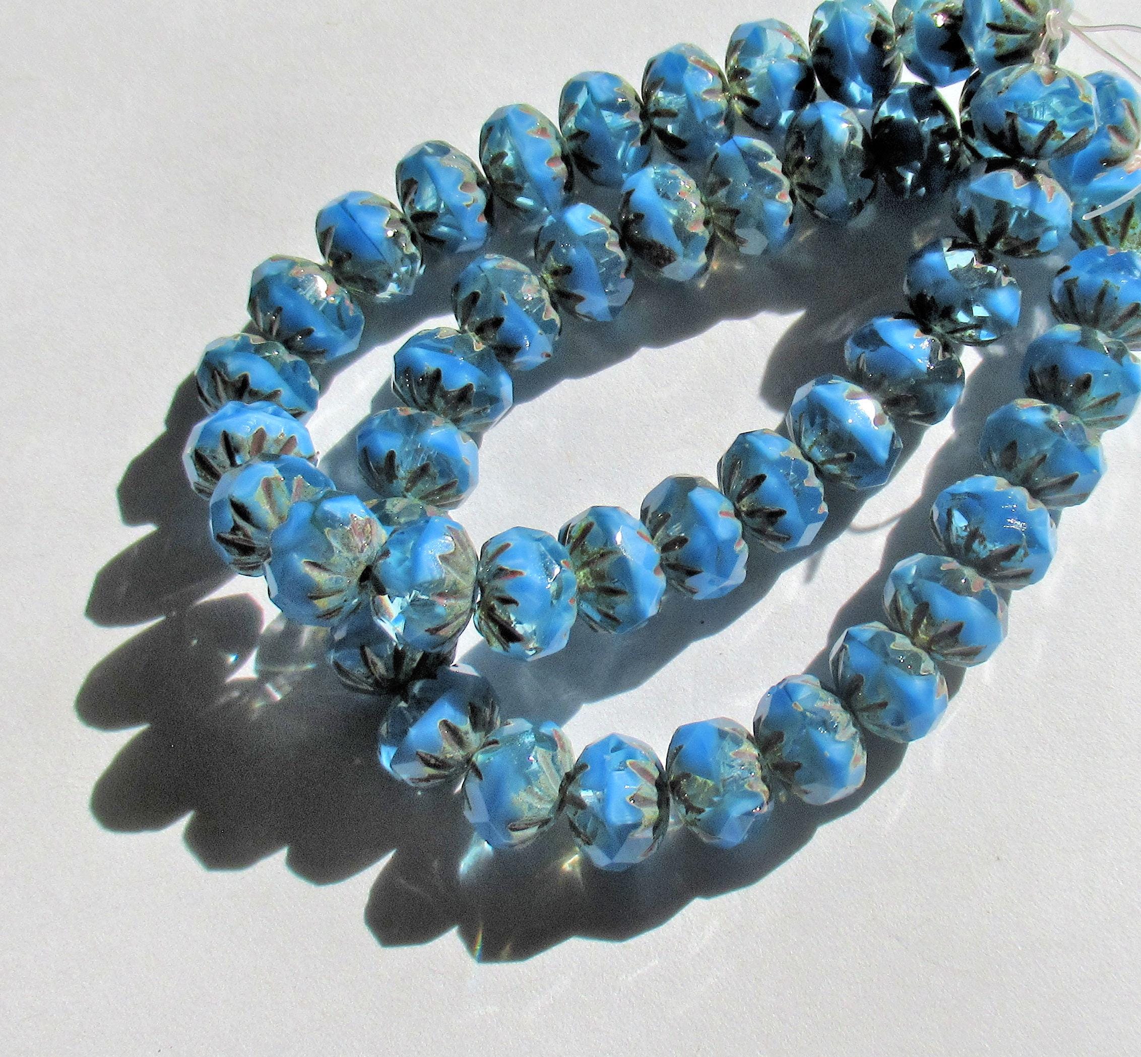 Ten Czech glass faceted carved cruller beads - 10 x 7mm - sky blue silk and crystal clear mix w/ picasso accents - 000451
