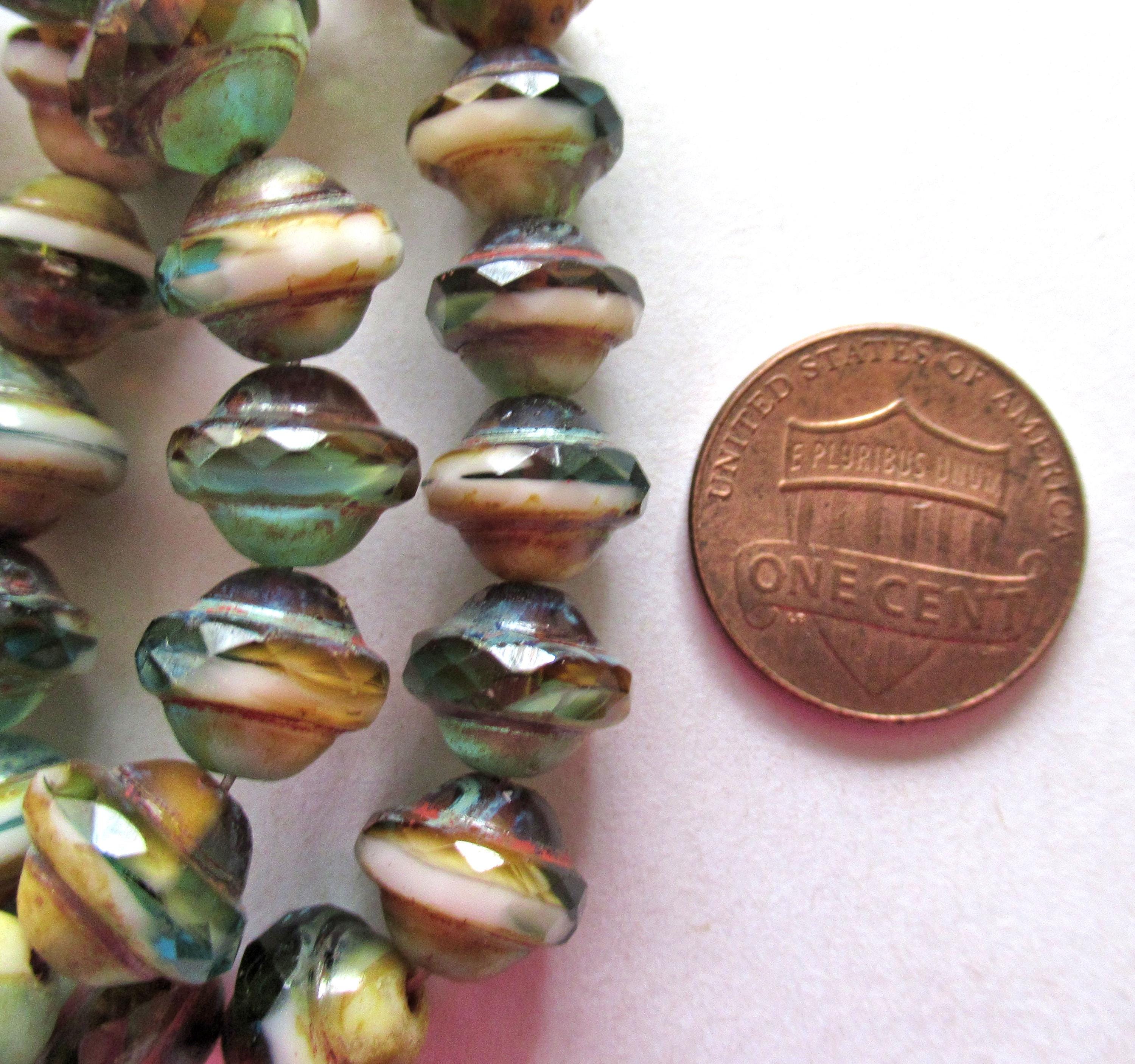 Fifteen Czech glass faceted saturn / saucer beads - 8 x 10mm - amber / blue green & white marbled mix with a picasso accents - C00302