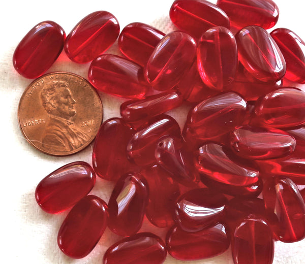 Lot of 15 transparent light garnet, ruby Red slightly twisted oval Czech Glass beads, 14mm x 8mm pressed glass beads C0047