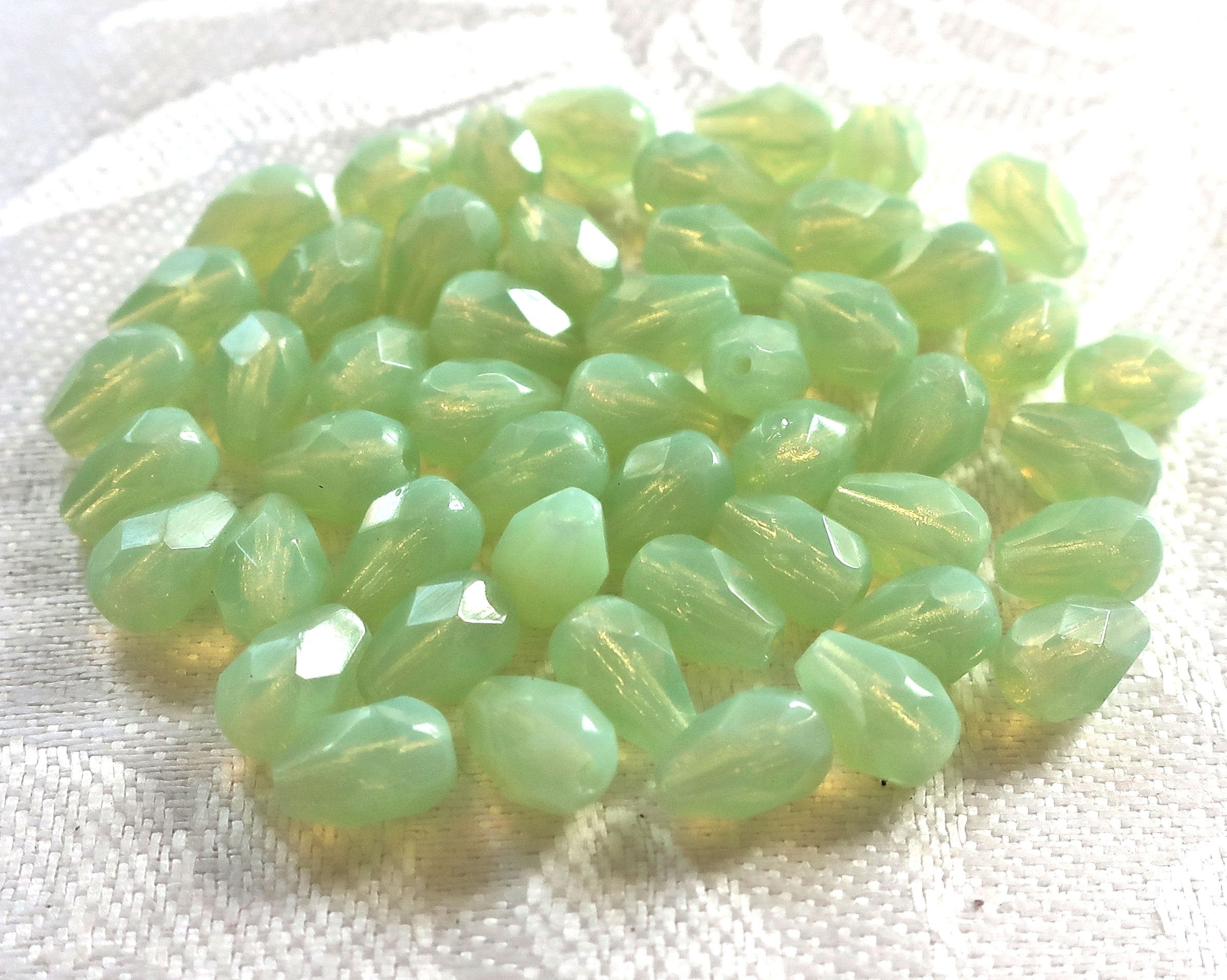 Lot of 25 7 x 5mm translucent light mint opal Green teardrop Czech glass beads, firepolished, faceted tear drops C5801 - Glorious Glass Beads