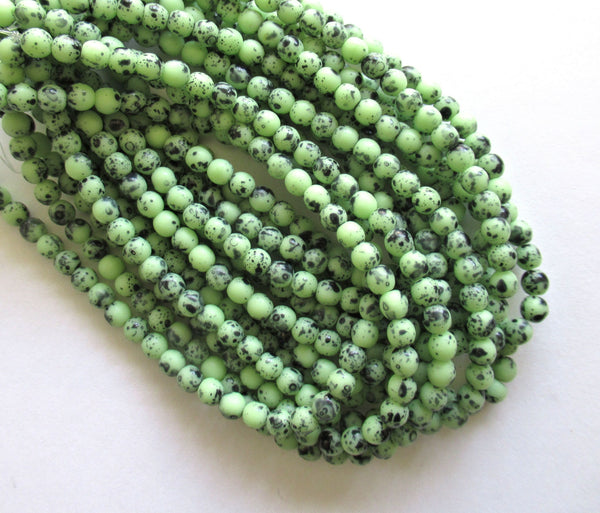 Lot of 50 4mm Czech glass druk beads - opaque speckled green smooth round druks - C0008