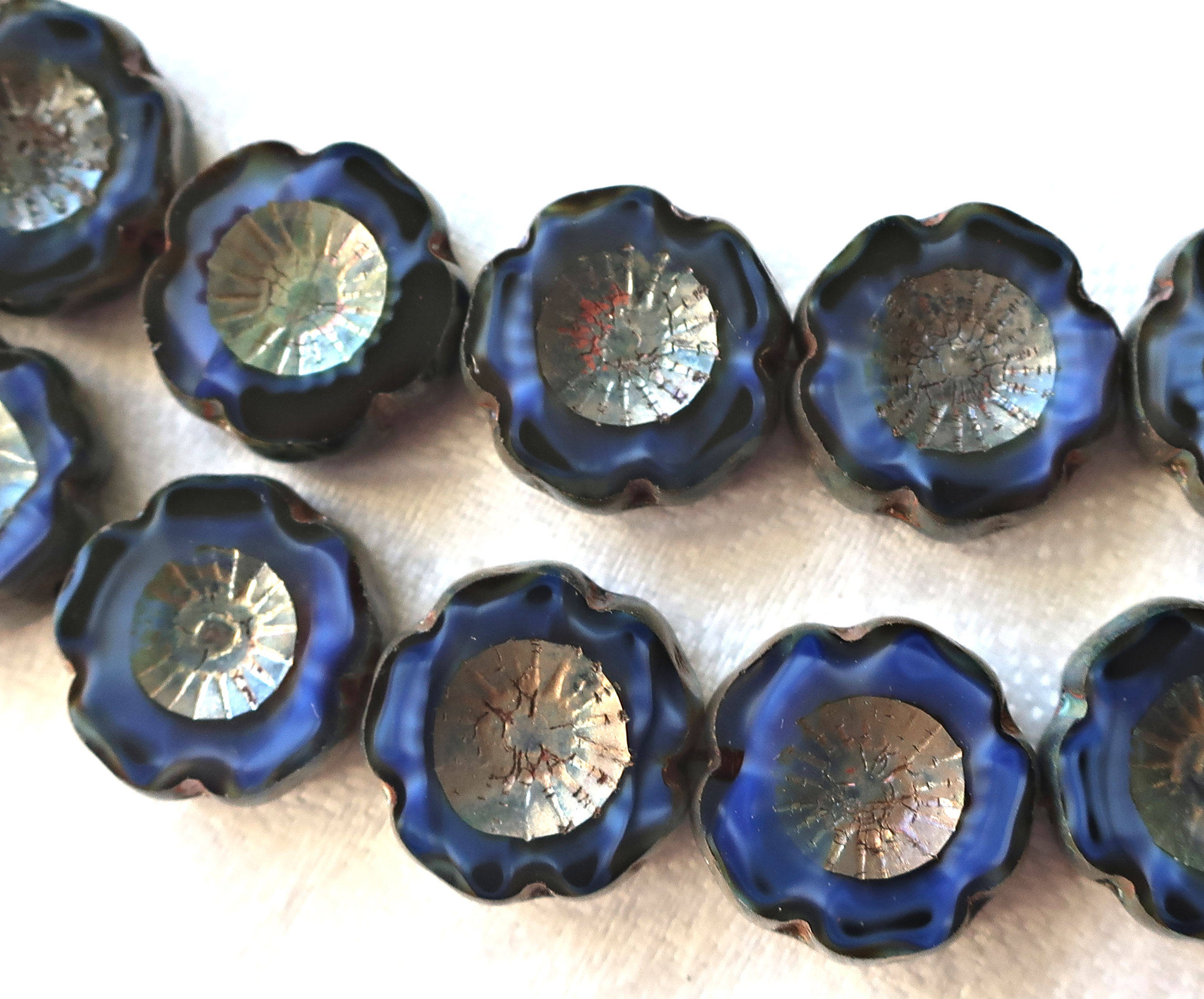 Lot of six 14mm table cut, carved, Czech glass flower beads. opaque, marbled satin, silk, midnight blue picasso Hawaiian flowers C80101 - Glorious Glass Beads