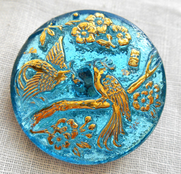 One 27mm Czech translucent aqua blue and gold glass peacock decorative shank button C02201