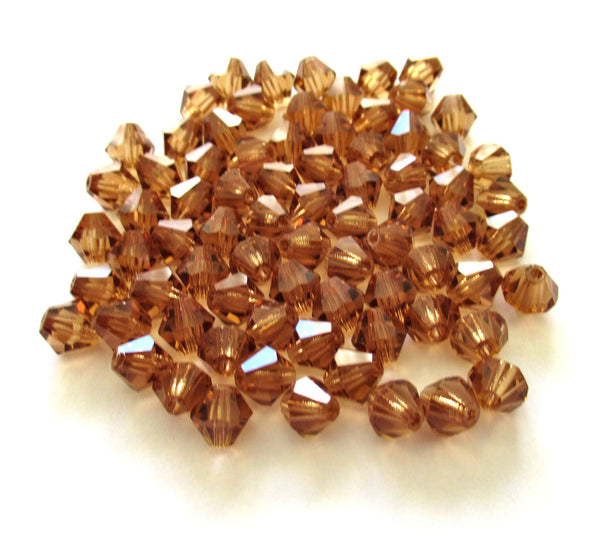 Lot of 24 6mm Czech Preciosa Crystal bicone beads - colorado topaz faceted glass brown bicones C00201