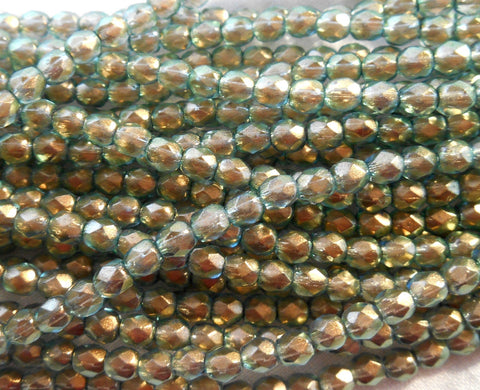 50 4mm Halo Heavens green Czech glass beads, light green firepolished, faceted round beads with a transparent gold finish, C0850
