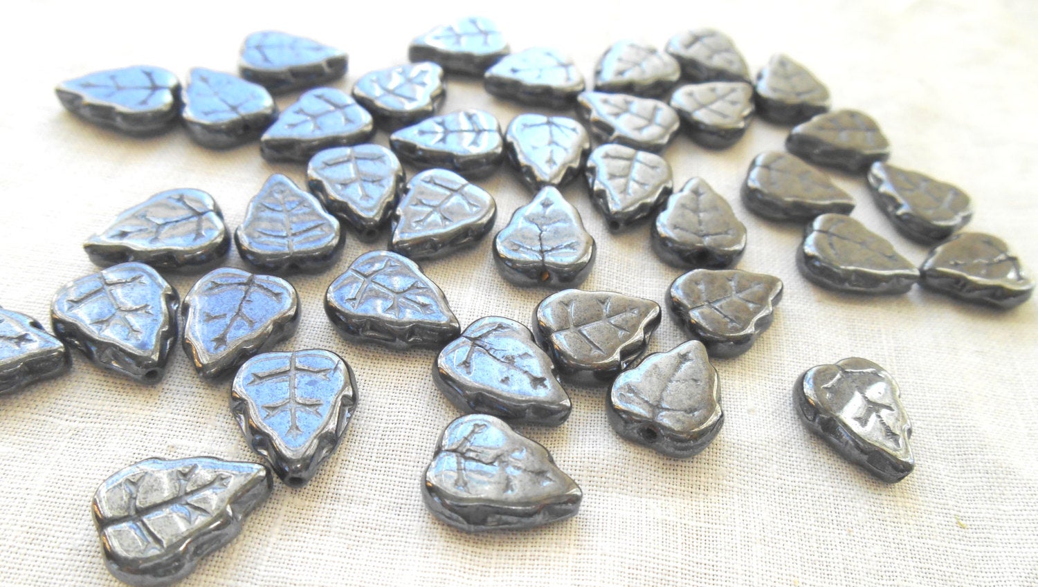 25 12 x 10mm Czech Hematite, metallic gray, center drilled, leaf beads, Czech glass beads C61125