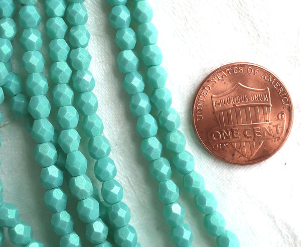 Lot of 50 4mm Opaque Aqua Glow Turquoise Czech glass beads, firepolished, faceted round beads, C3601 - Glorious Glass Beads