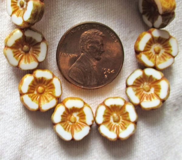 Twelve Czech glass flower beads - 12mm table cut, carved, opaque white Hawaiian flower beads with a golden brown picasso finish C31201