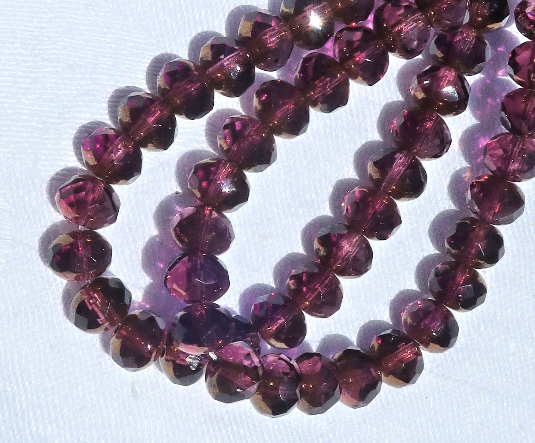 25 Czech glass faceted puffy rondelle beads - 5 x 7mm transparent & purple / amethyst with a bronze picasso finish rondelles C00201 - Glorious Glass Beads