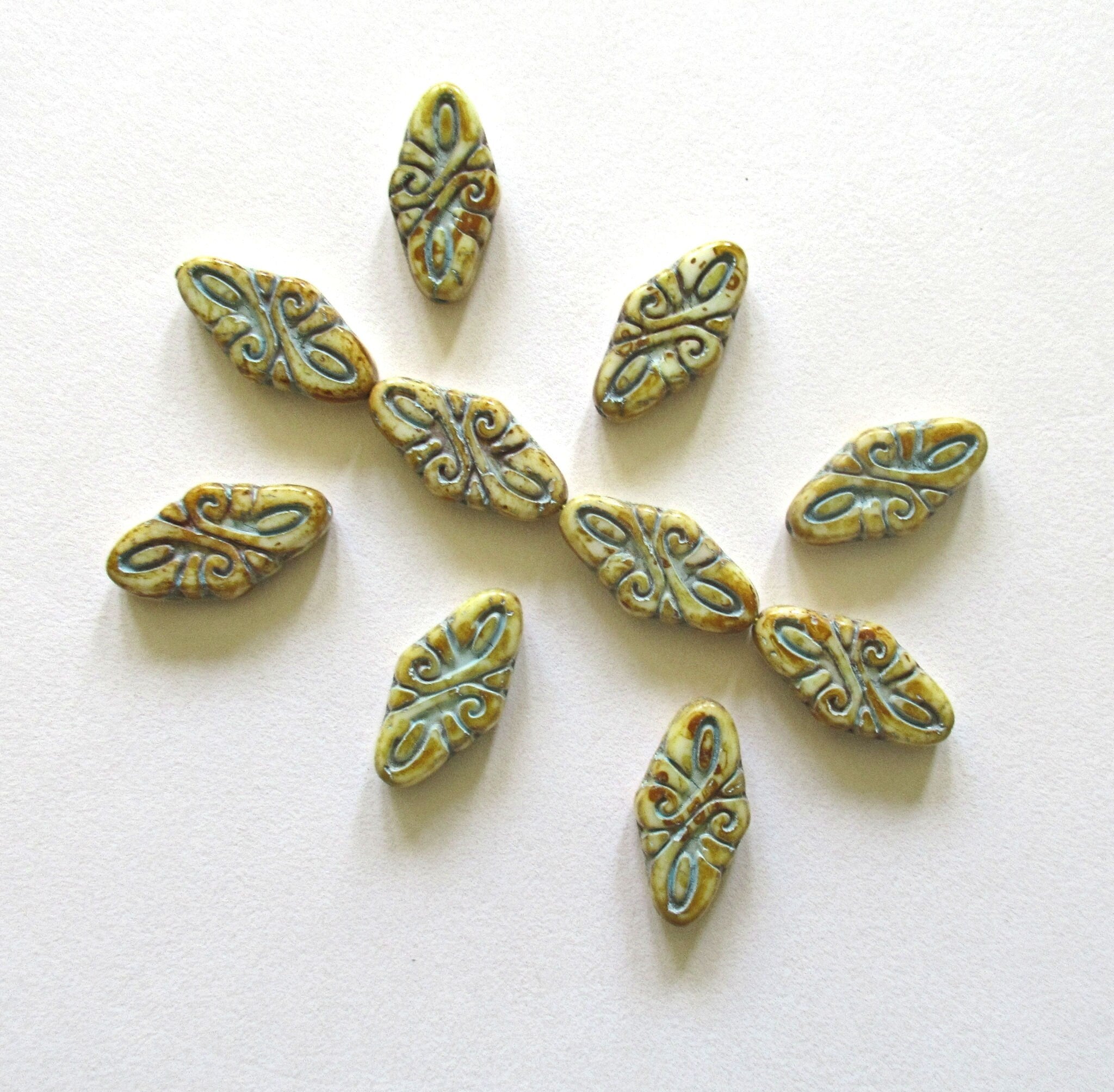 8 Czech glass arabesque beads - 9 x 19mm off white diamond shaped engraved beads with a full picasso coat & a blue wash - C0007