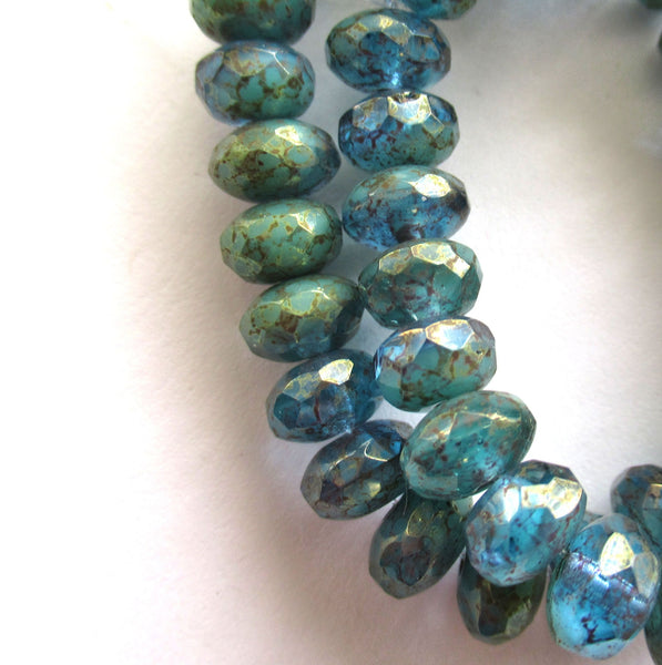 Lot of 25 faceted puffy rondelle or donut Czech glass beads - 5 x 6mm transparent sea blue with a splotchy purple luster finish - C00201