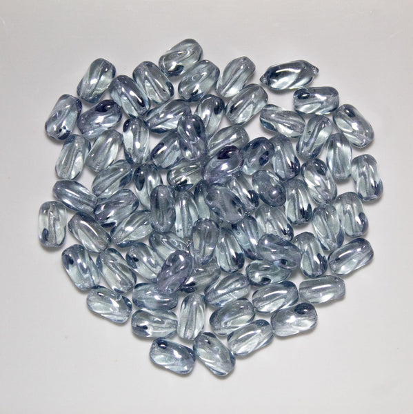25 9mm x 6mm Lumi Blue Czech glass twisted oval beads C0044