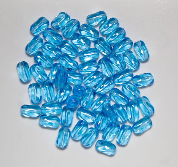 25 9mm x 6mm Aqua Blue Czech glass small twisted oval beads C0076