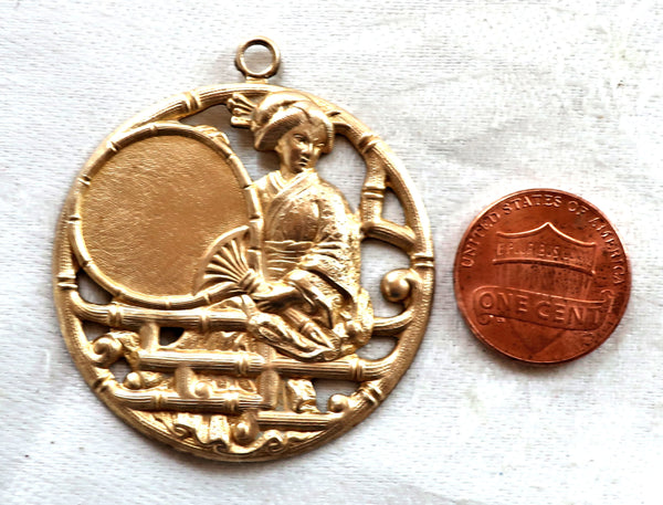 1 Asian brass medallion, pendant, woman, geisha with fan charm, ornament, brass stamping, japonaiserie, 46mm x 40mm, made in the USA C12101 - Glorious Glass Beads