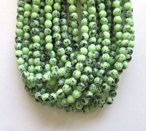 Lot of 50 4mm Czech glass druk beads - opaque speckled green smooth round druks - C0008