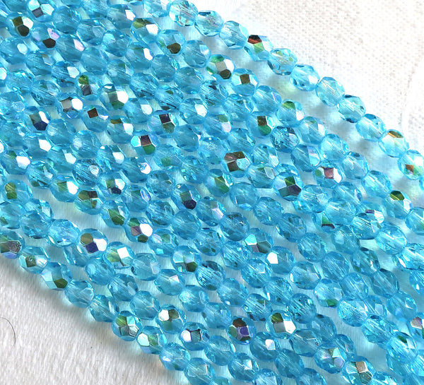 Lot of 50 4mm Aqua Blue AB Czech glass beads, firepolished faceted round beads C8501 - Glorious Glass Beads