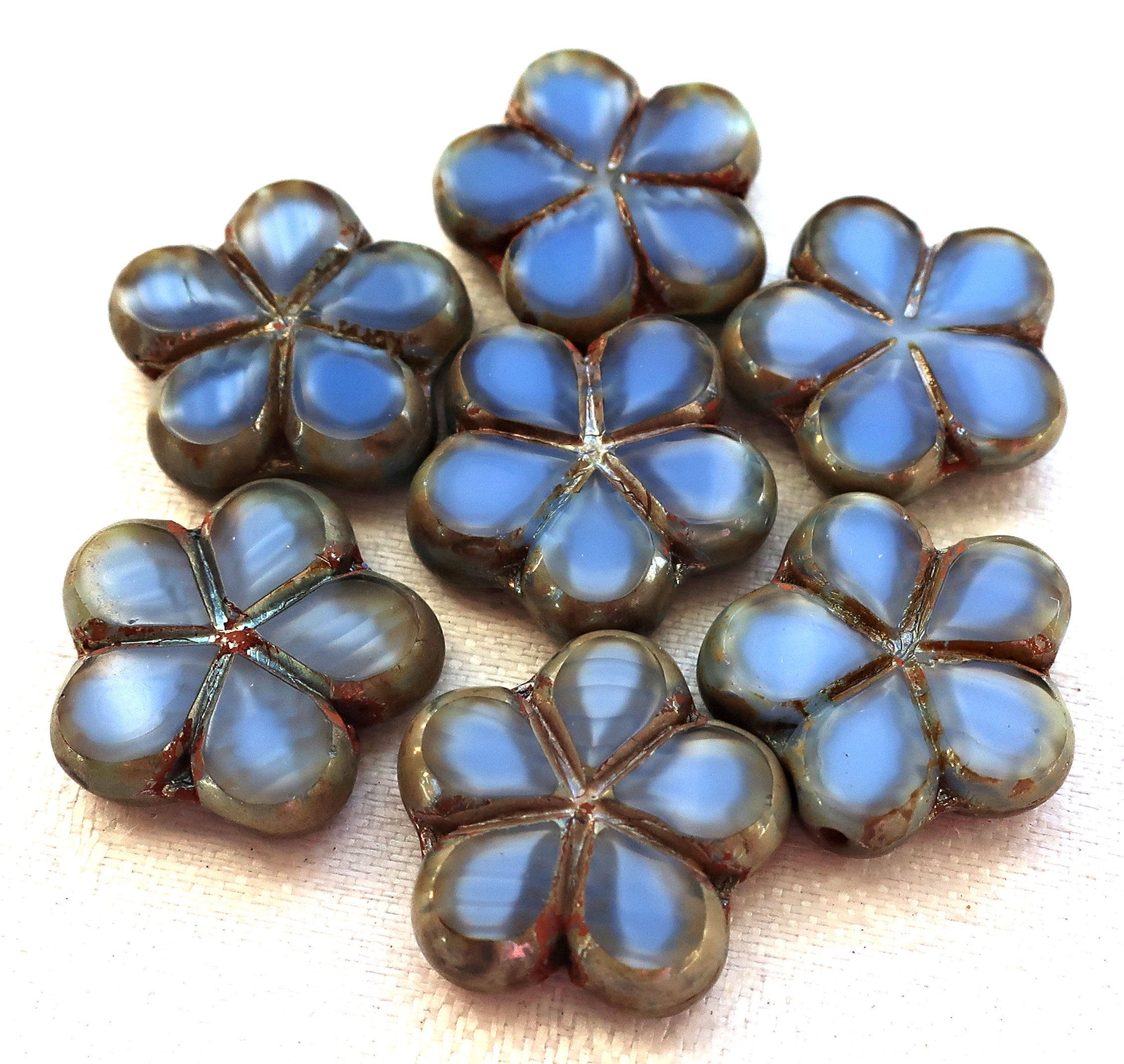 Lot of five 17mm table cut, carved,opaque, marbled denim blue with silver picasso accents, Czech glass flower beads C51105 - Glorious Glass Beads