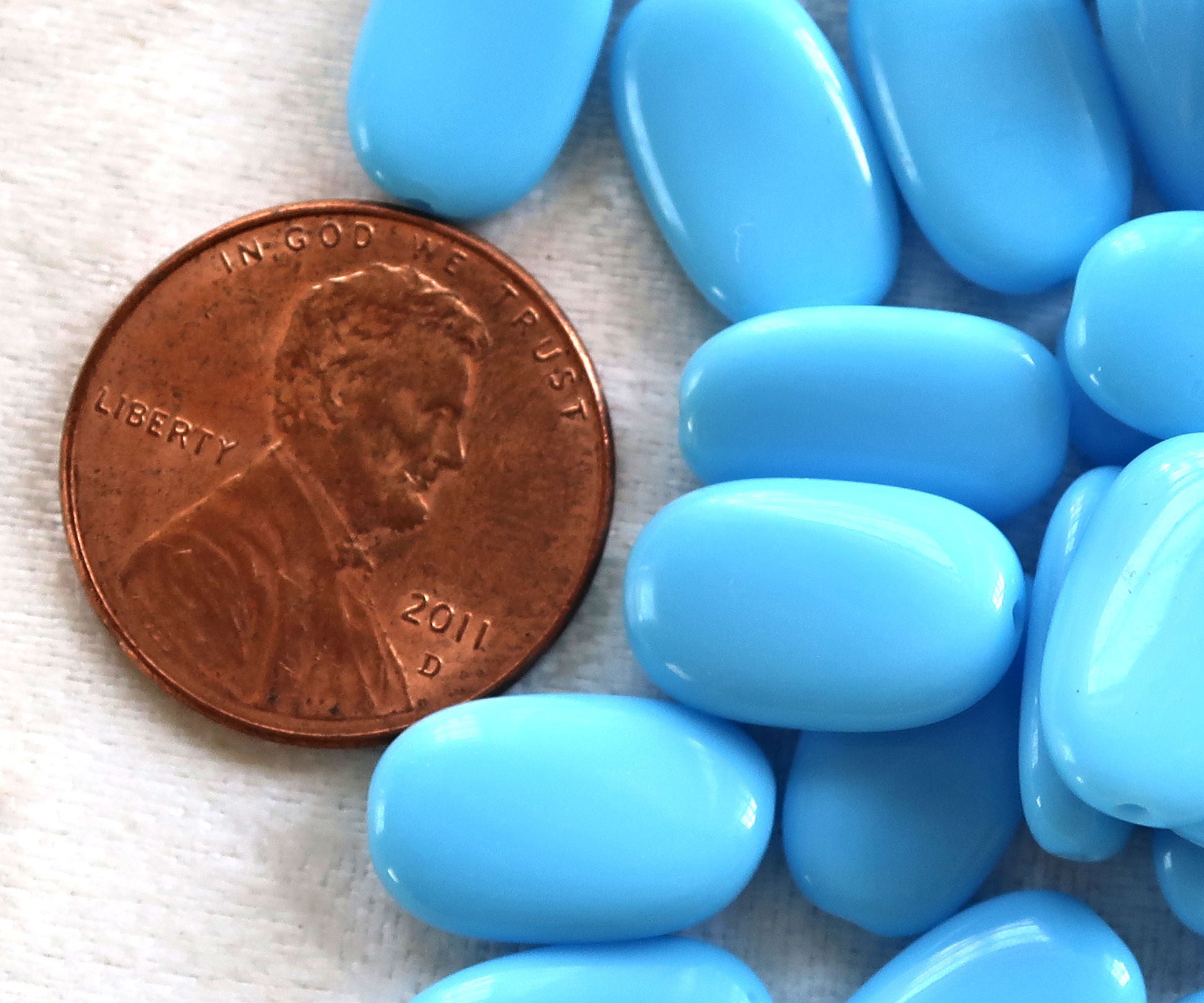 Lot of 25 opaque Turquoise Blue slightly twisted oval Czech Glass beads, 14mm x 8mm pressed glass beads C8925 - Glorious Glass Beads