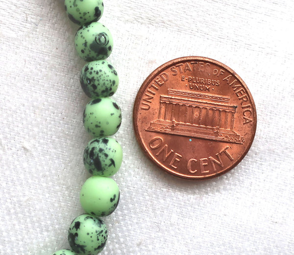 30 6mm Czech glass mint green spotted druk beads, spattered, speckled bird's egg, matte mint green smooth round druks C51130 - Glorious Glass Beads