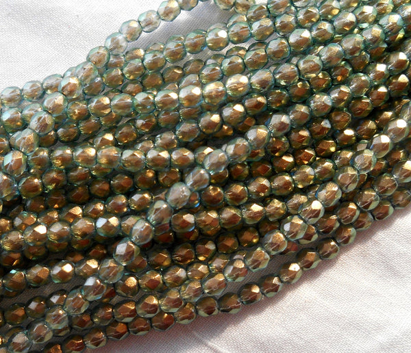 50 4mm Halo Heavens green Czech glass beads, light green firepolished, faceted round beads with a transparent gold finish, C0850