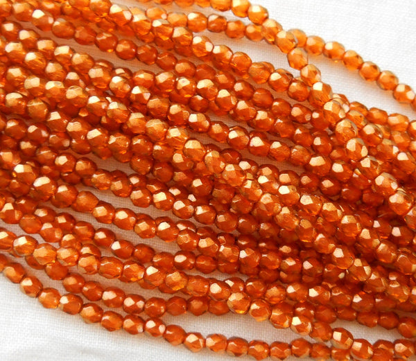 50 3mm Halo Sandalwood Orange Czech beads, Sienna glass over gold, firepolished, faceted round beads, C8650