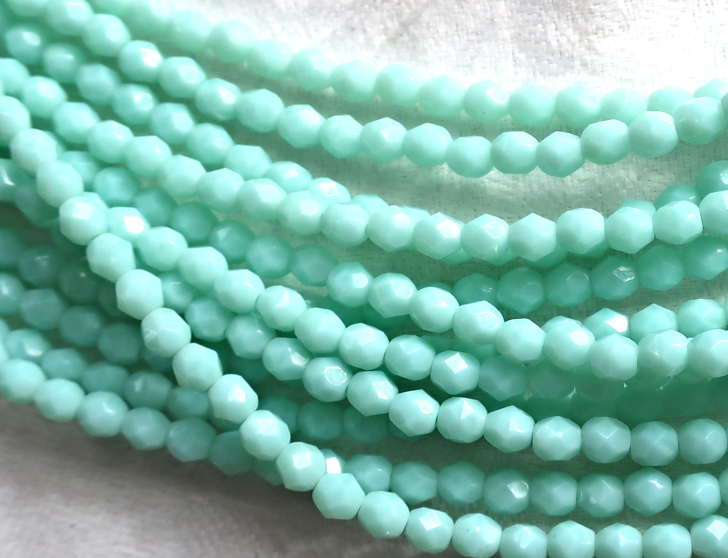 Lot of 50 4mm Opaque Pale Jade Green Czech glass beads, opaque light green faceted. firepolished round beads C8501 - Glorious Glass Beads