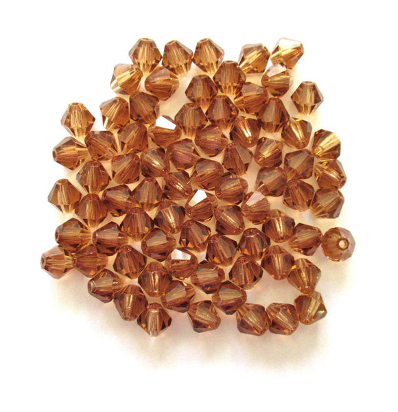 Lot of 24 6mm Czech Preciosa Crystal bicone beads - colorado topaz faceted glass brown bicones C00201