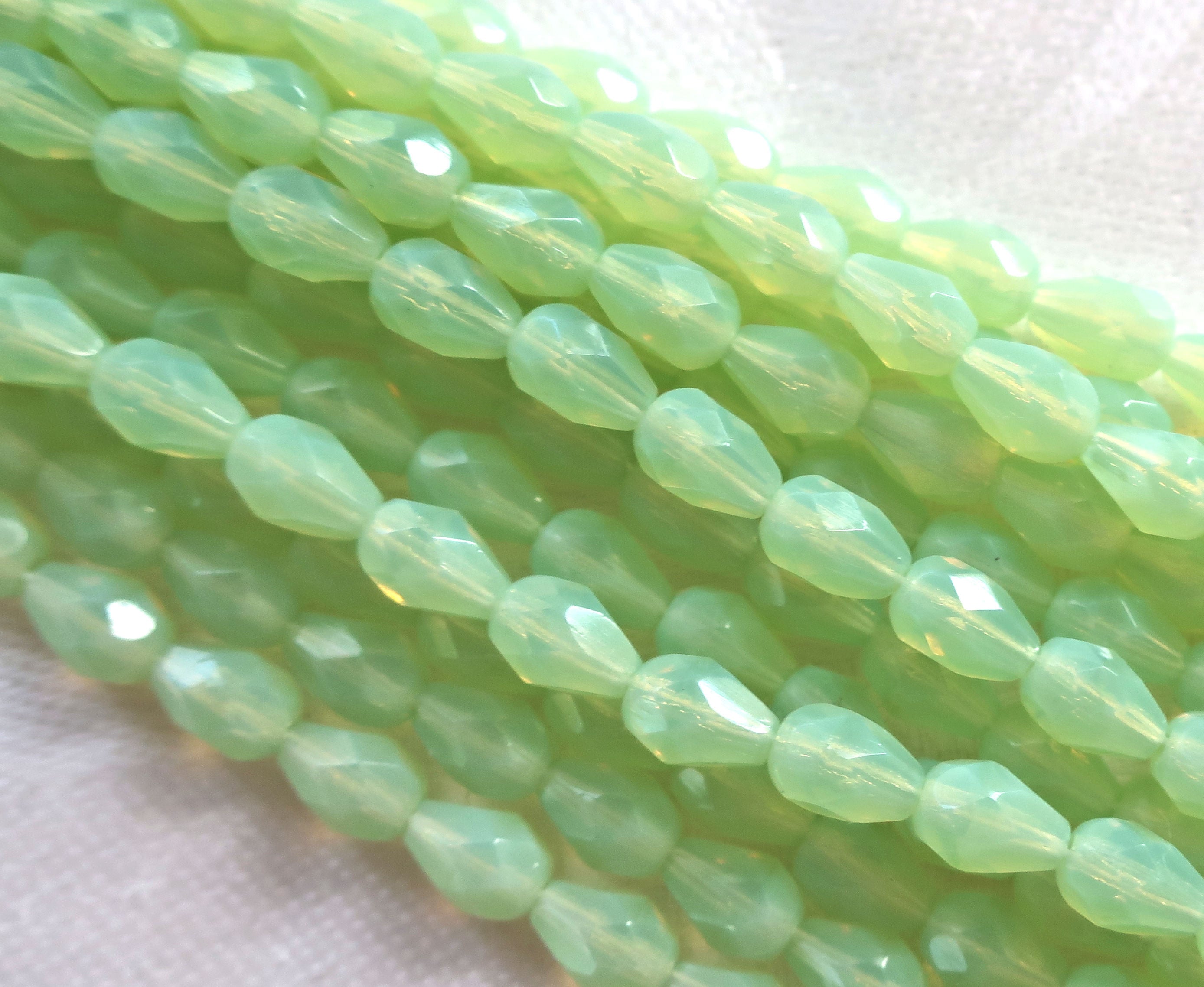Lot of 25 7 x 5mm translucent light mint opal Green teardrop Czech glass beads, firepolished, faceted tear drops C5801 - Glorious Glass Beads