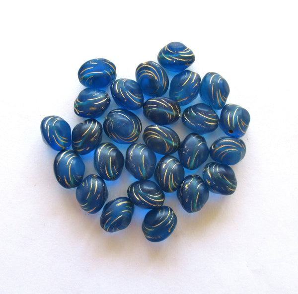 Lot of fifteen oval 10 x 9mm Czech glass snail beads - translucent capri blue and gold carved glass snail beads C12101
