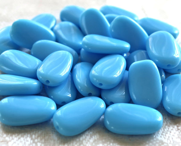 Lot of 25 opaque Turquoise Blue slightly twisted oval Czech Glass beads, 14mm x 8mm pressed glass beads C8925 - Glorious Glass Beads