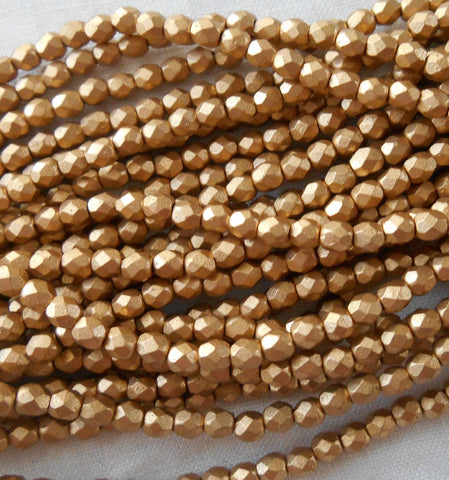 50 3mm Matte Metallic Gold Flax Czech glass beads, firepolished, faceted round beads C7550 - Glorious Glass Beads