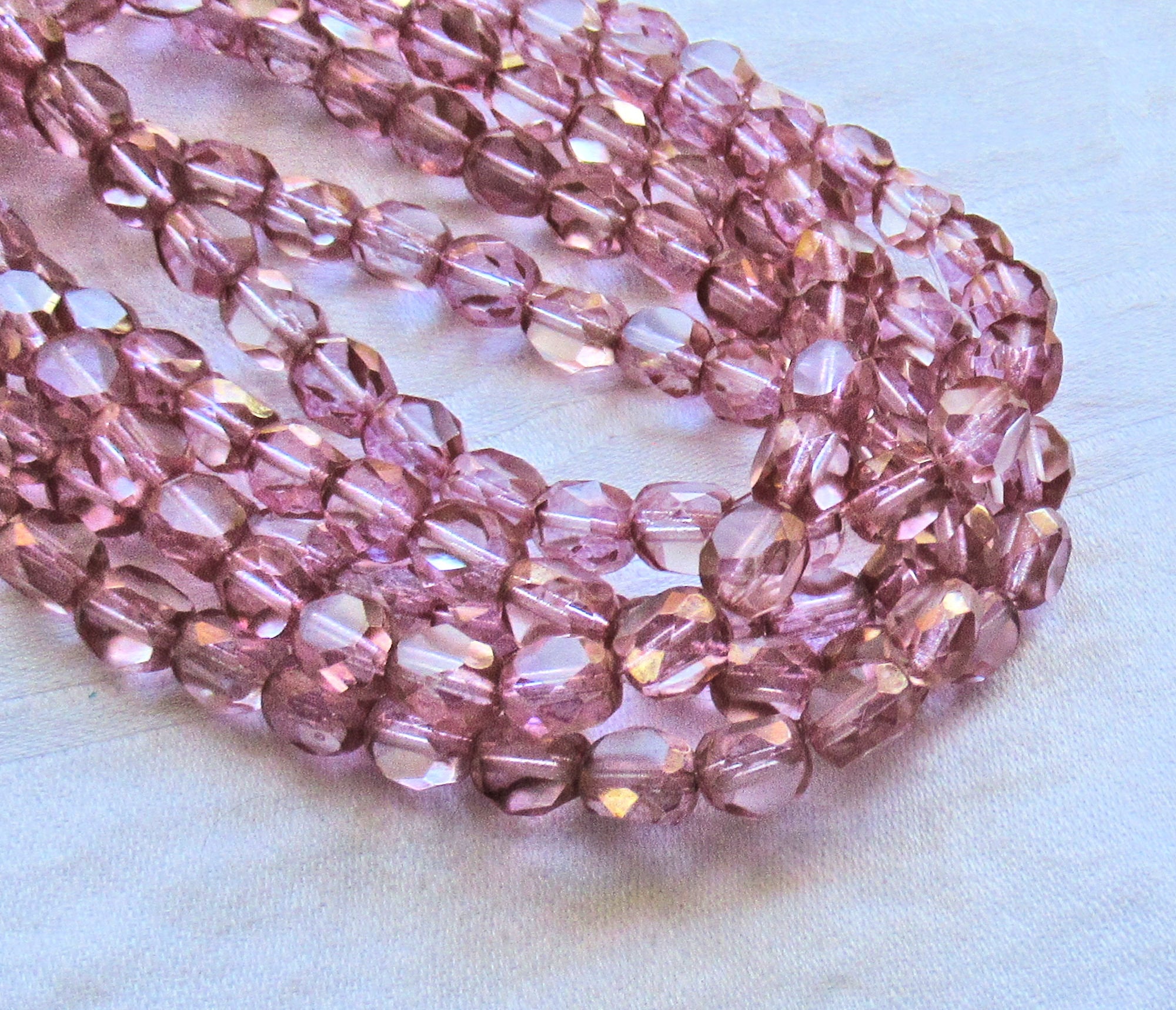 25 Tricut, Tri-cut Czech glass Round beads - pink with gold accents - 8mm - table cut faceted window beads - C61201 - Glorious Glass Beads