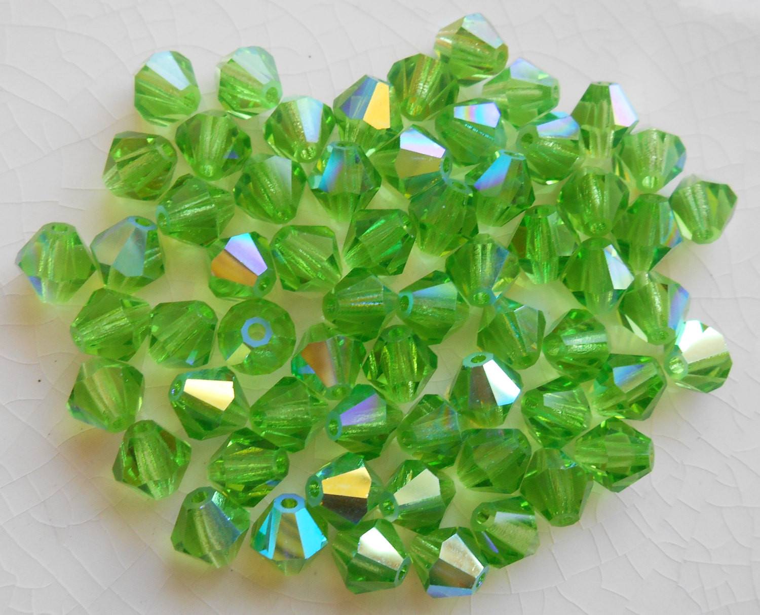 Lot of 24 6mm Peridot Green AB Czech Preciosa Crystal bicone beads, faceted glass green AB bicones C60101 - Glorious Glass Beads