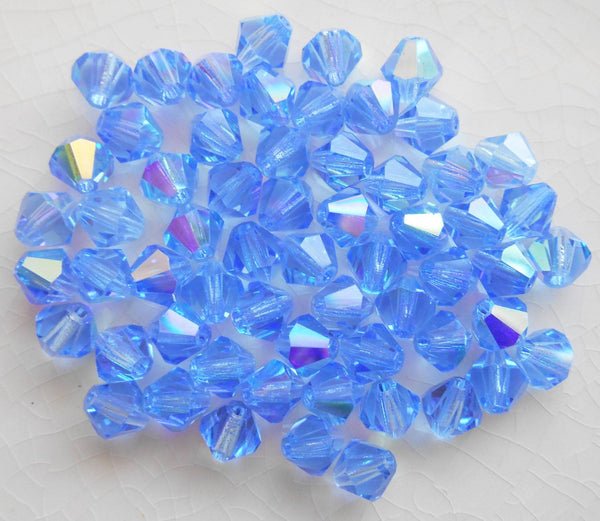 Lot of 24 6mm Sapphire Blue AB Czech Preciosa Crystal bicone beads, faceted glass blue AB bicones C60101 - Glorious Glass Beads
