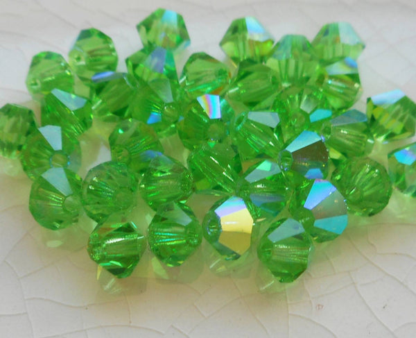 Lot of 24 4mm Czech Peridot AB glass faceted bicone beads, Preciosa Green AB bicones 5601 - Glorious Glass Beads