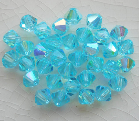 Lot of 24 4mm Aqua blue AB Czech Preciosa Crystal bicone beads, faceted glass blue AB bicones C5601 - Glorious Glass Beads