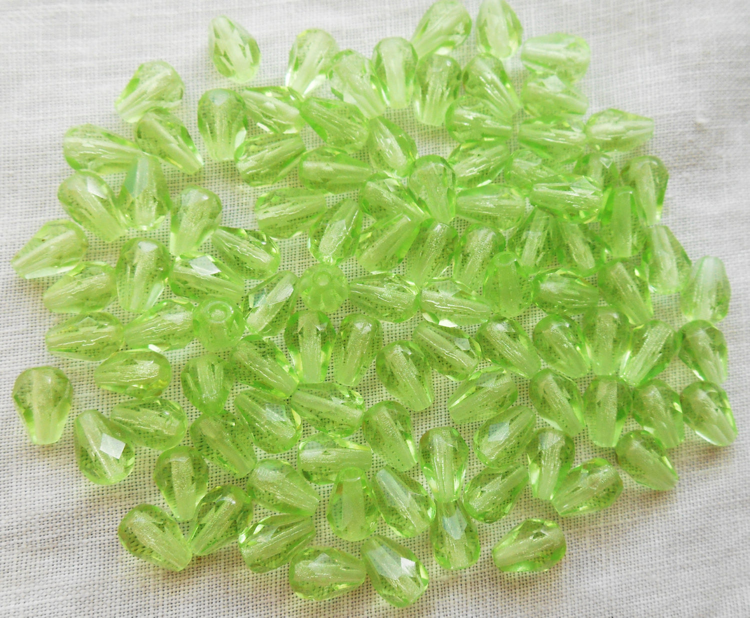 Lot of 25 7 x 5mm Peridot Green teardrop Czech glass beads, faceted firepolished beads C3601 - Glorious Glass Beads