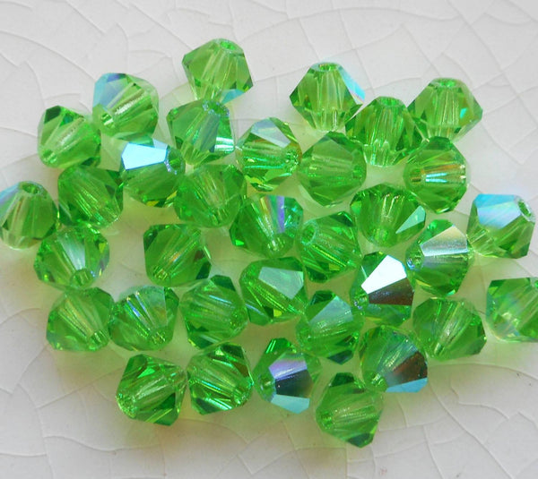 Lot of 24 4mm Czech Peridot AB glass faceted bicone beads, Preciosa Green AB bicones 5601 - Glorious Glass Beads