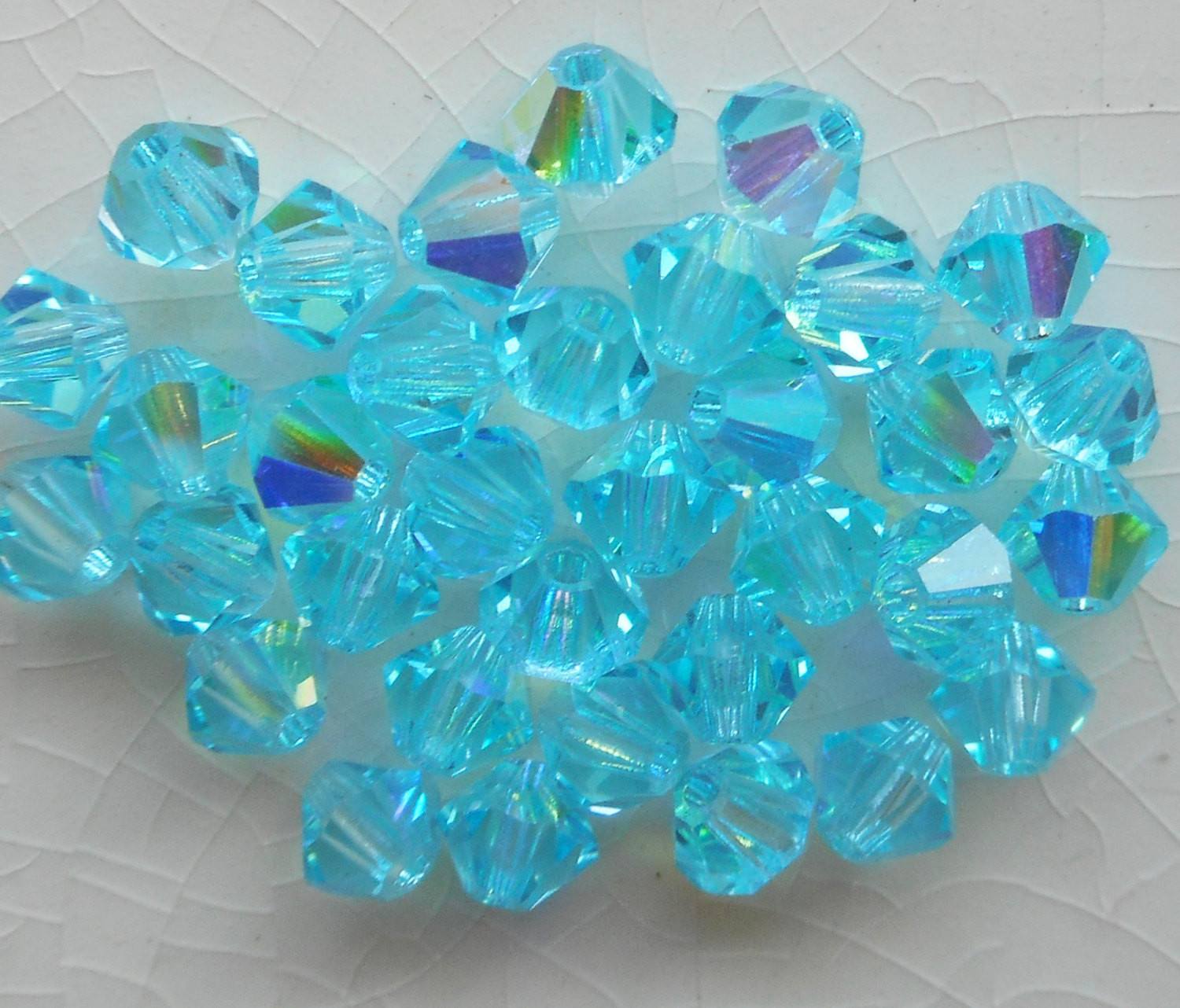 Lot of 24 4mm Aqua blue AB Czech Preciosa Crystal bicone beads, faceted glass blue AB bicones C5601 - Glorious Glass Beads
