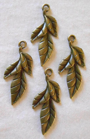 Two antique bronze leaf charms, pendants, 39m by 11mm , three metal leaves C6102 - Glorious Glass Beads