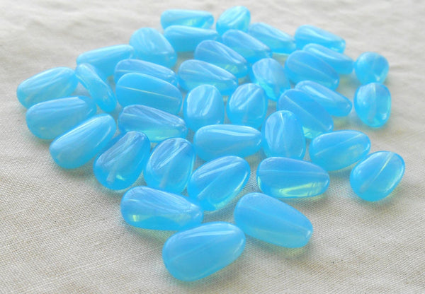Lot of 25 Powder Blue Opal slightly twisted oval Czech pressed Glass beads, 14mm x 8mm, C3625 - Glorious Glass Beads