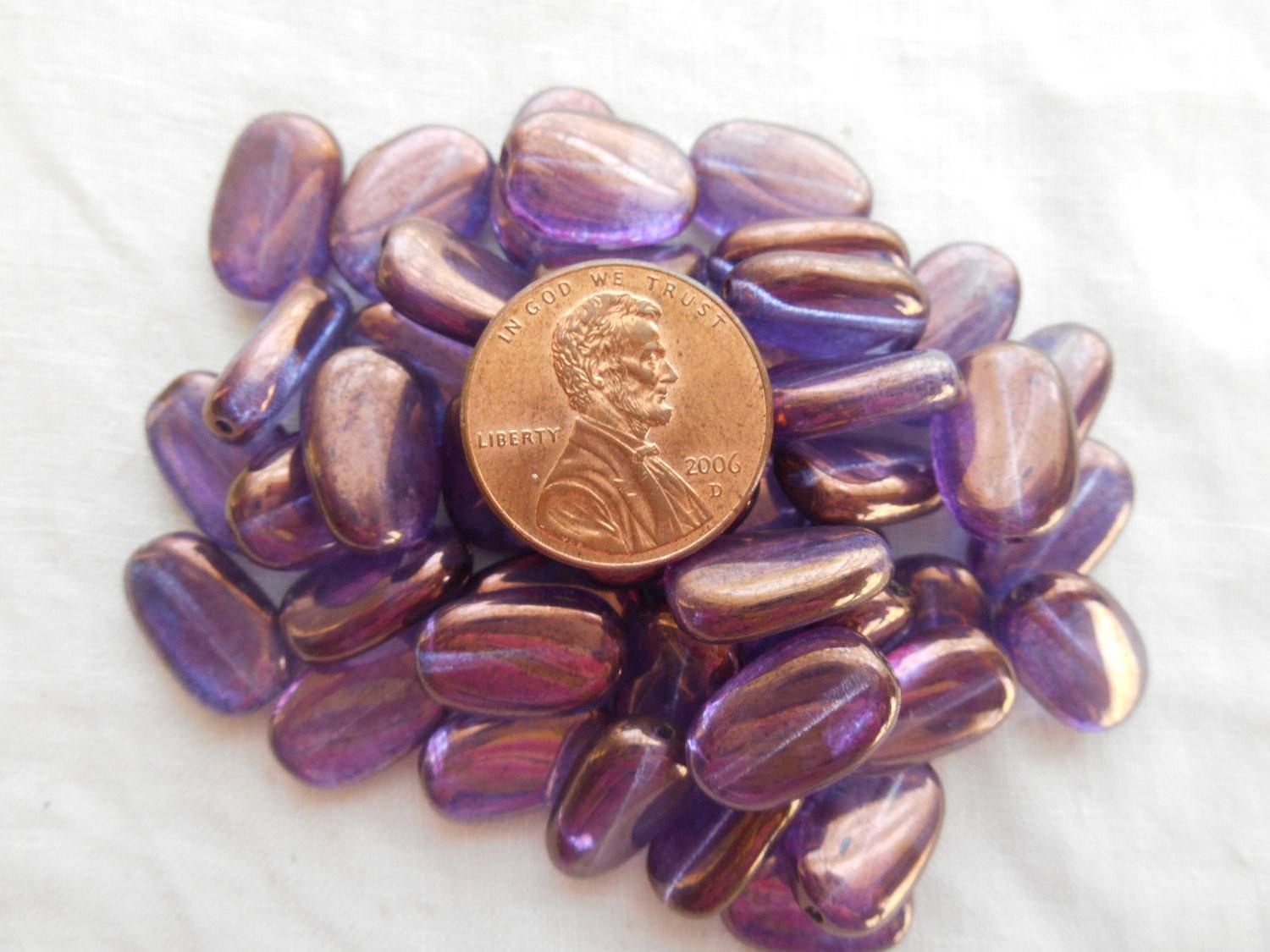 Lot of 25 Lumi Amethyst Iridescent slightly twisted oval Czech pressed Glass beads, 14mm x 8mm, C3325 - Glorious Glass Beads