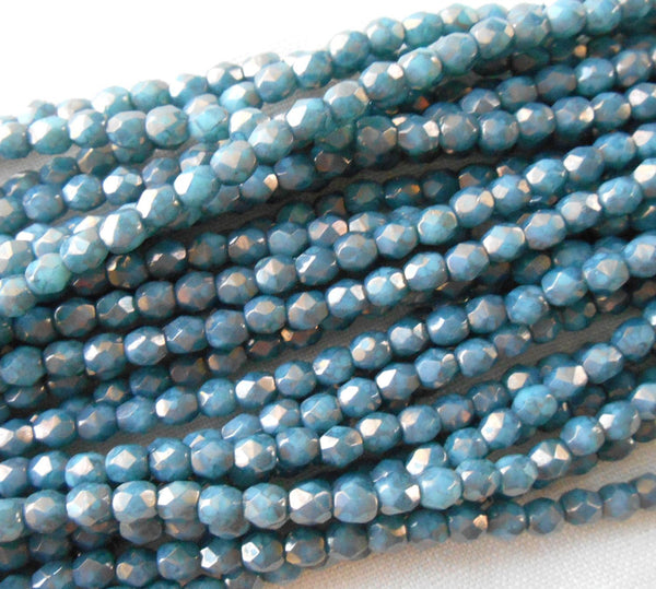 Fifty 3mm Opaque Turquoise Moon Dust Czech glass firepolished, faceted round beads with a golden finish, C4550 - Glorious Glass Beads